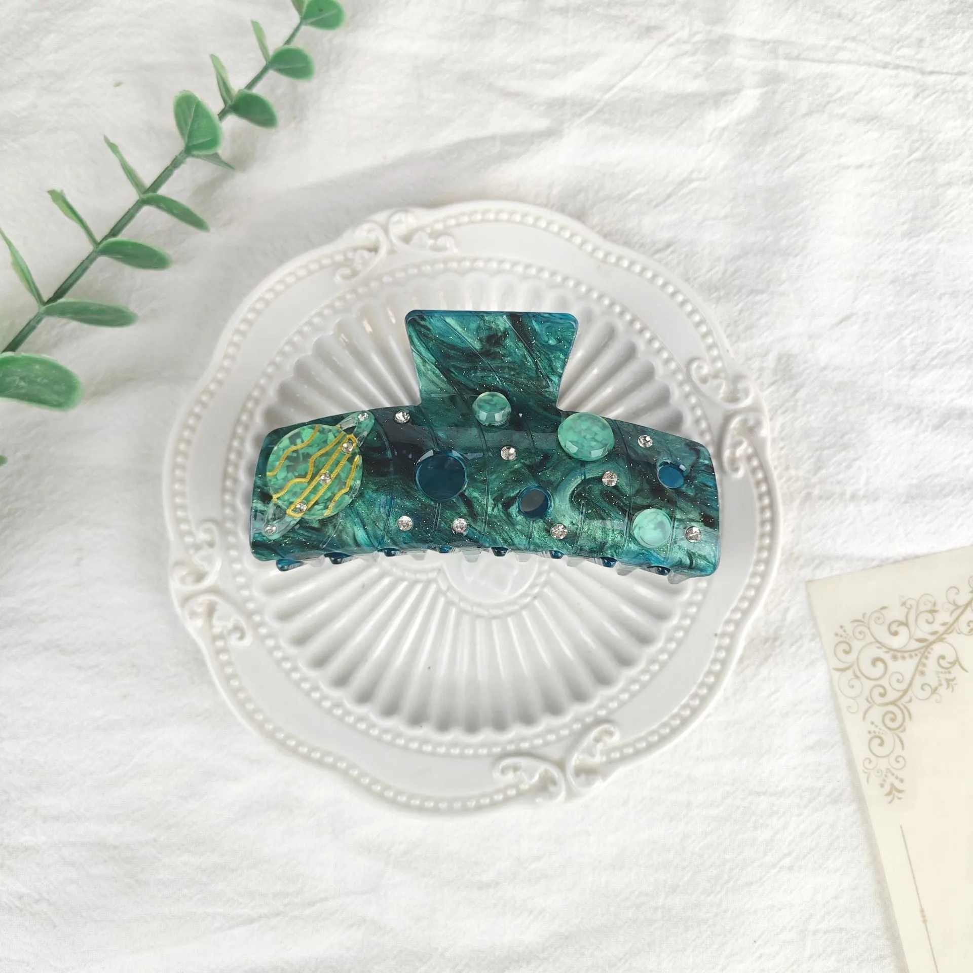 Oversized women's barrette with star moon starry sky design in cellulose acetate sheet material