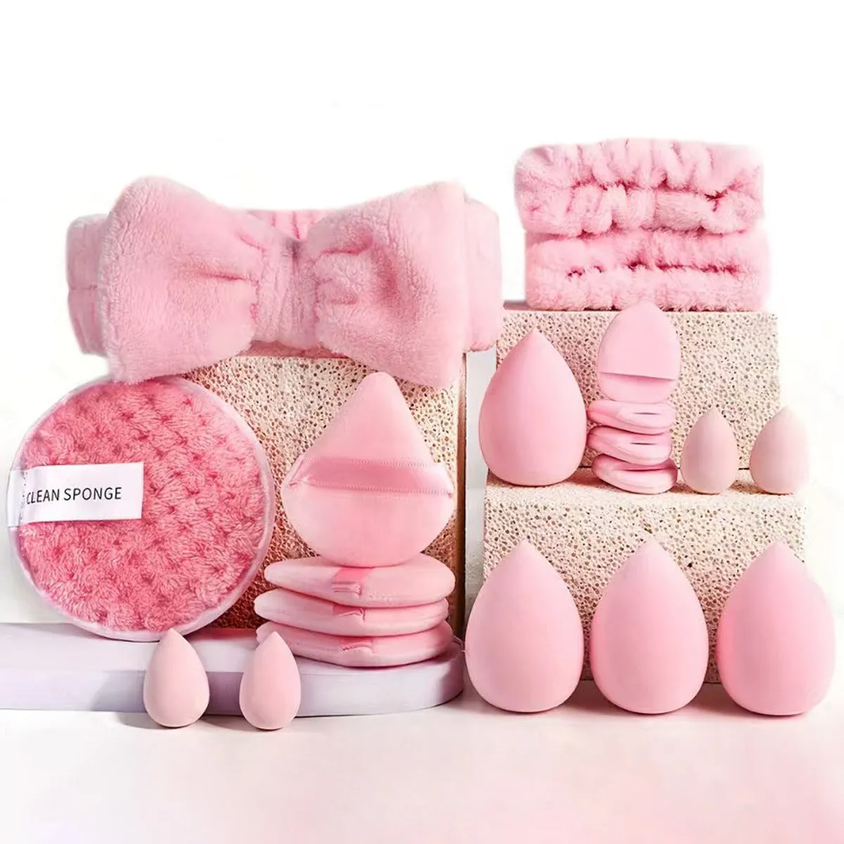 Beauty tool combination set with multiple pieces in brown, pink, and purple colours for face wash and makeup application