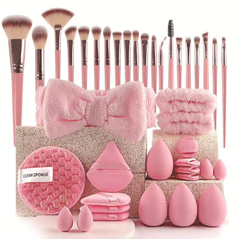 Beauty tool combination set with multiple pieces in brown, pink, and purple colours for face wash and makeup application