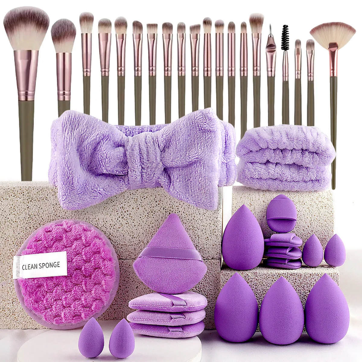 Beauty tool combination set with multiple pieces in brown, pink, and purple colours for face wash and makeup application