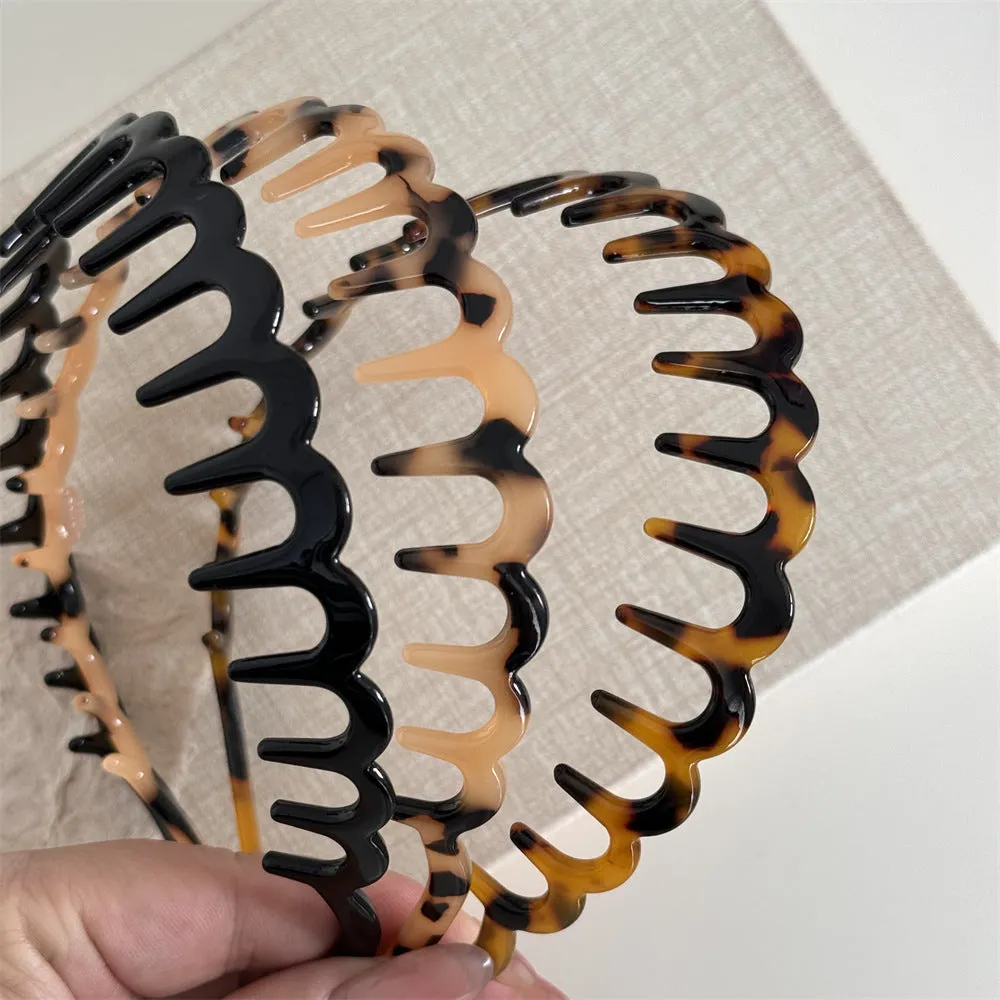 Women's acetate fibre toothed hair hoop in black colour, showing non-slip wave pressure nozzle and irregular Korean-style shape.