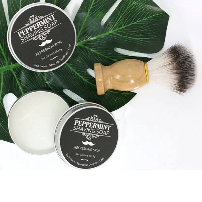 Mint scented shaving soap in aluminium box with rich foam on brush