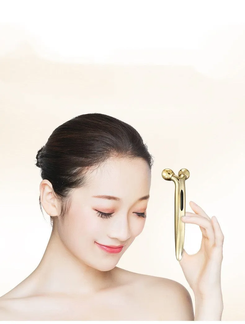 3D face-lifting manual roller massager with positive ion function in silver UV-plated finish