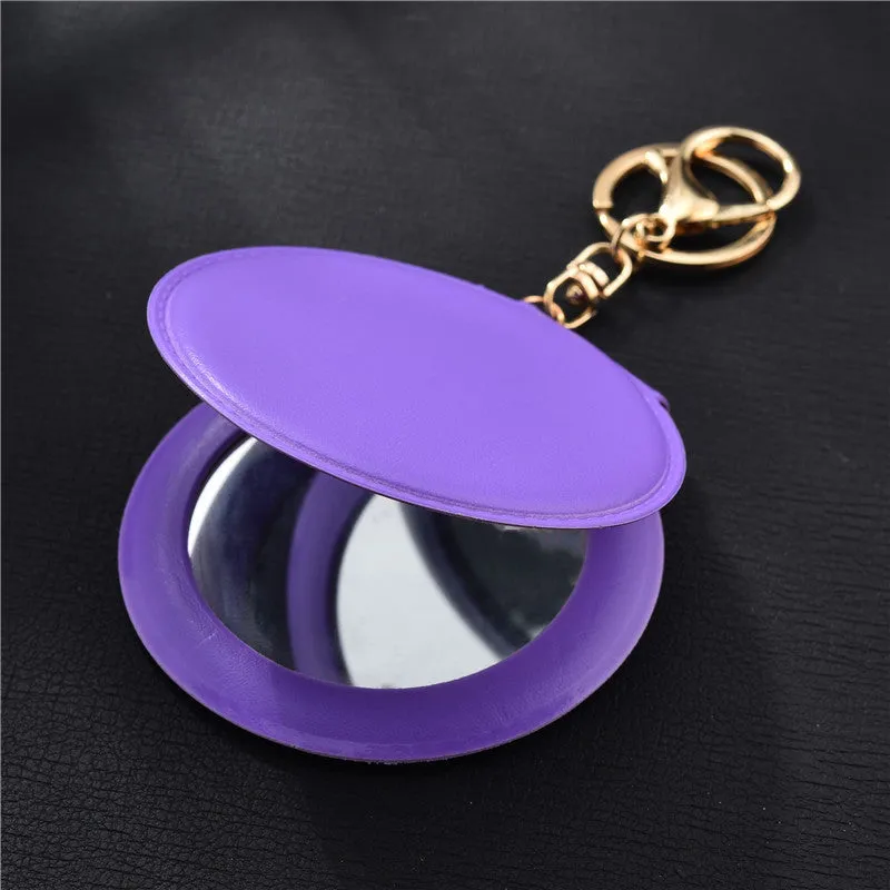 Compact round ladies leather makeup mirror with 8cm diameter glass surface and golden buckle