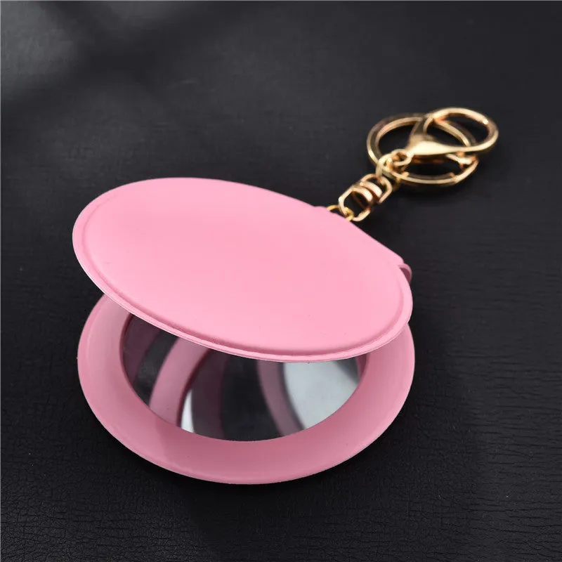 Compact round ladies leather makeup mirror with 8cm diameter glass surface and golden buckle