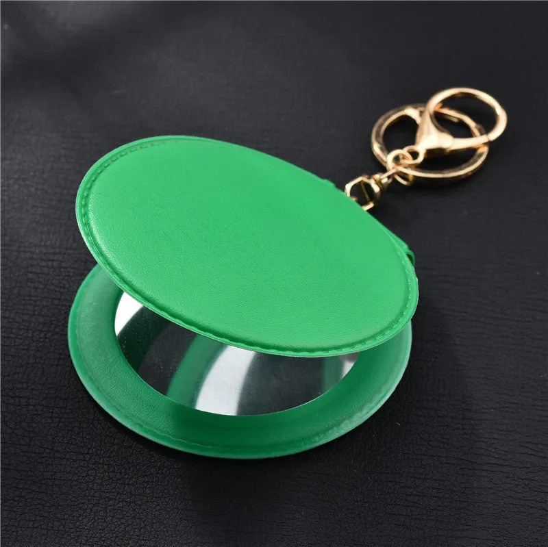 Compact round ladies leather makeup mirror with 8cm diameter glass surface and golden buckle