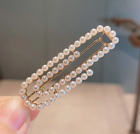 White pearl hair clip set with geometric weaving pattern on metal acrylic base