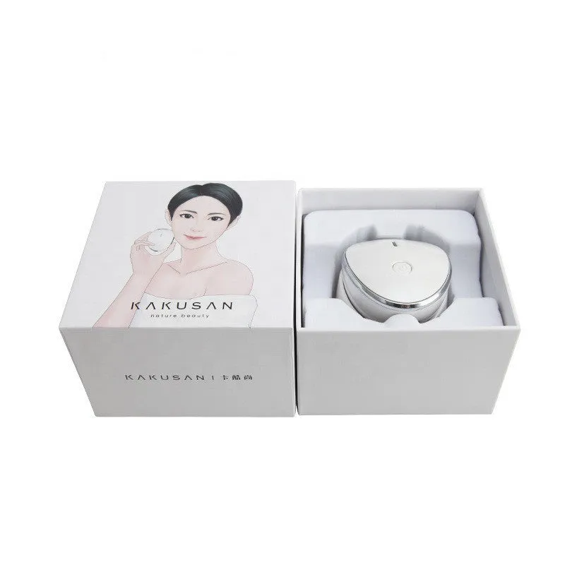 White multifunction USB charging facial cleansing massager with hot egg design, silicone brush head, and 5 vibration modes on a white background