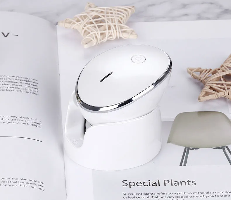 White multifunction USB charging facial cleansing massager with hot egg design, silicone brush head, and 5 vibration modes on a white background