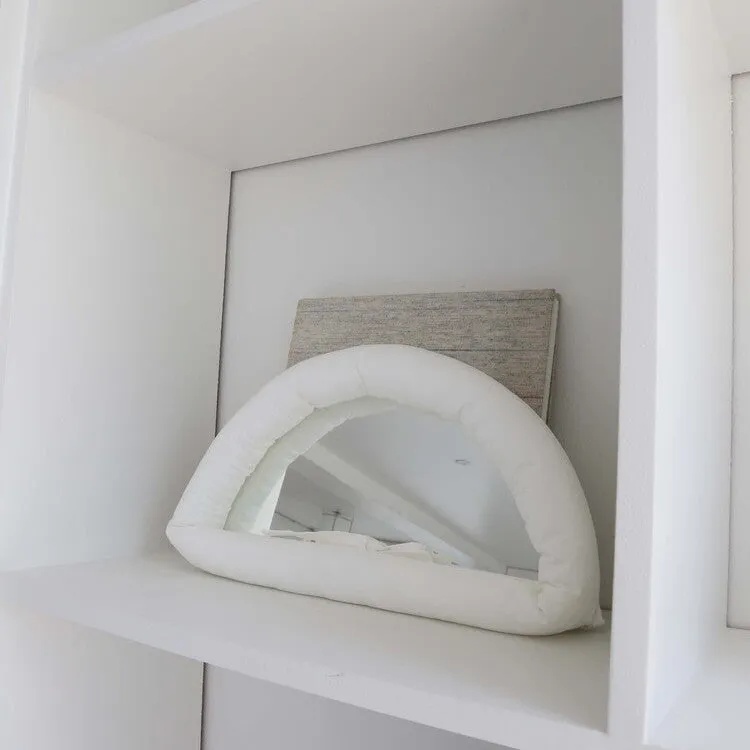 Hanging fabric mirror with soft cotton-filled backing in 23x40x5cm size