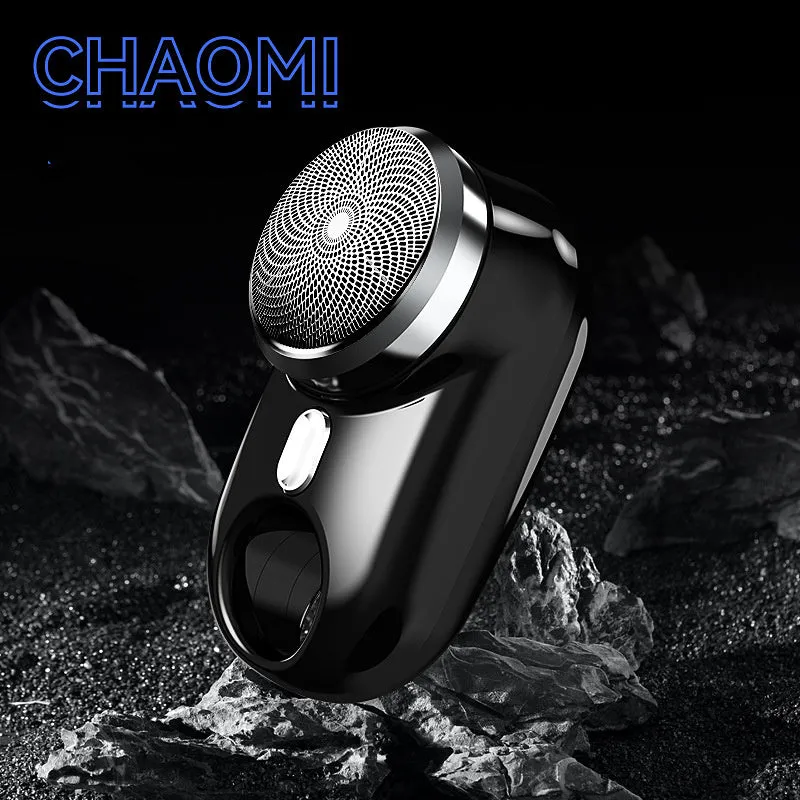Silver travel waterproof mini electric shaver with rotary head and LED display on white background