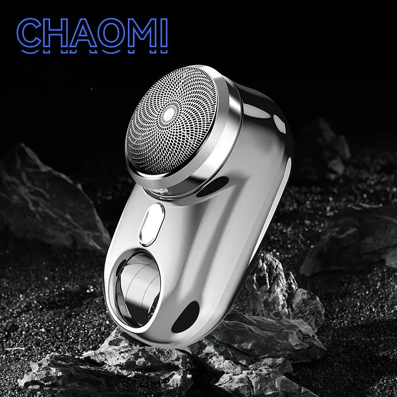 Silver travel waterproof mini electric shaver with rotary head and LED display on white background