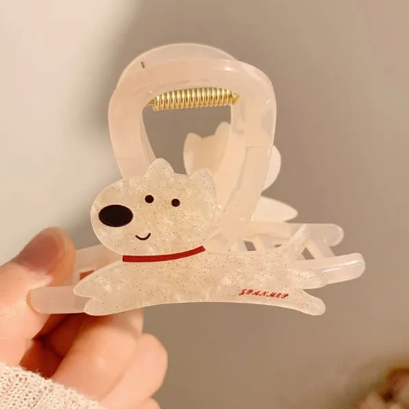 Cute cartoon puppy shaped hair barrettes with a grip clip, shown in beige and brown colours.