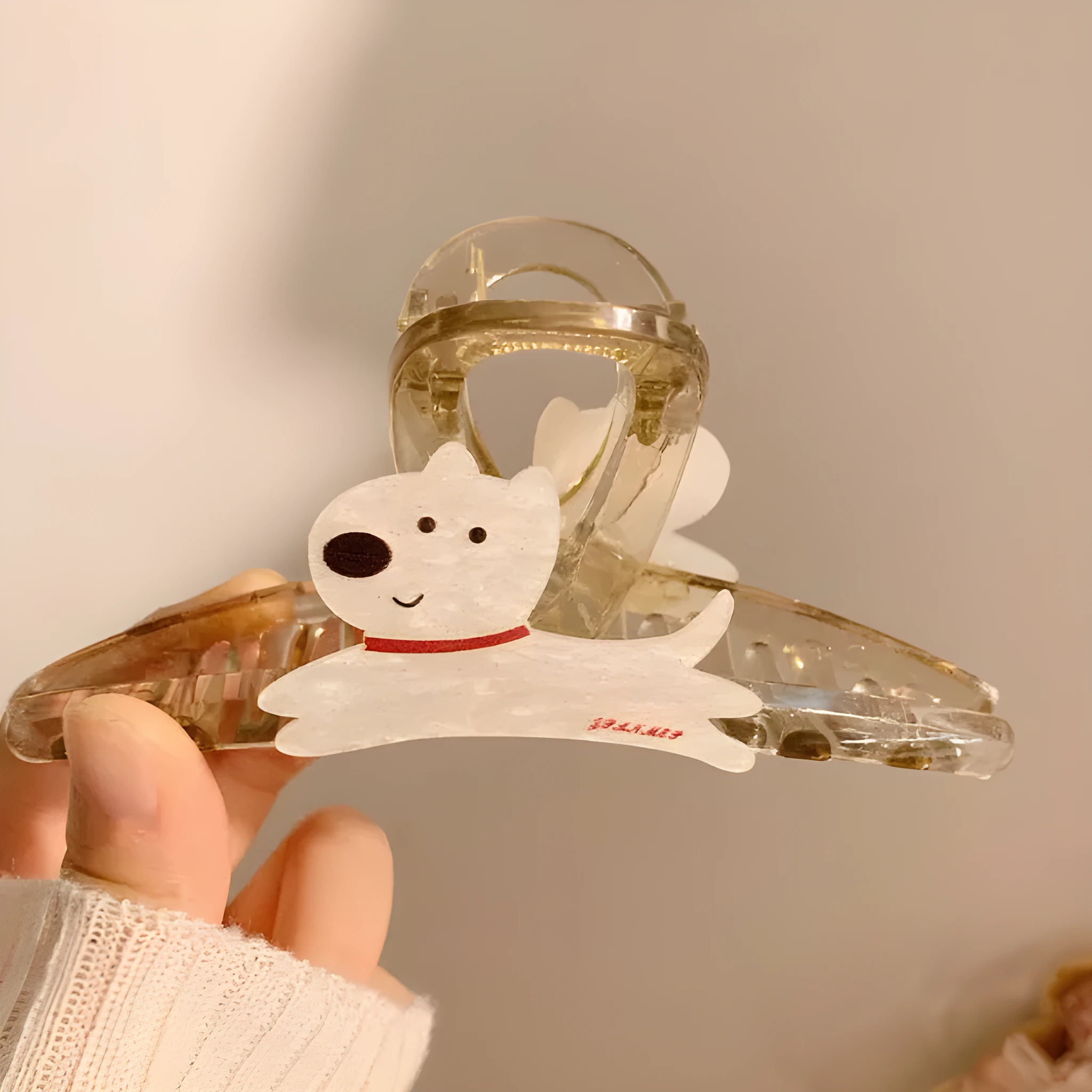Cute cartoon puppy shaped hair barrettes with a grip clip, shown in beige and brown colours.