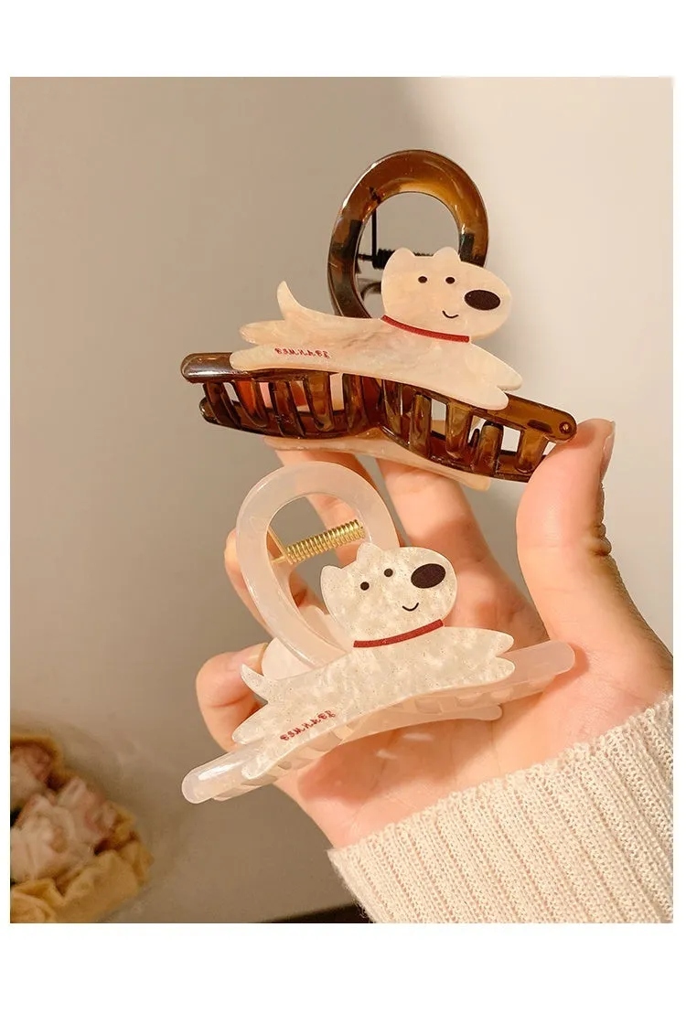 Cute cartoon puppy shaped hair barrettes with a grip clip, shown in beige and brown colours.
