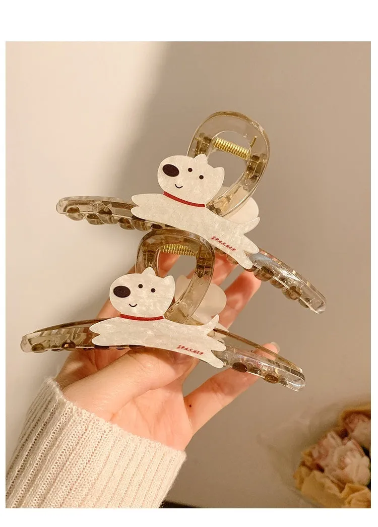 Cute cartoon puppy shaped hair barrettes with a grip clip, shown in beige and brown colours.