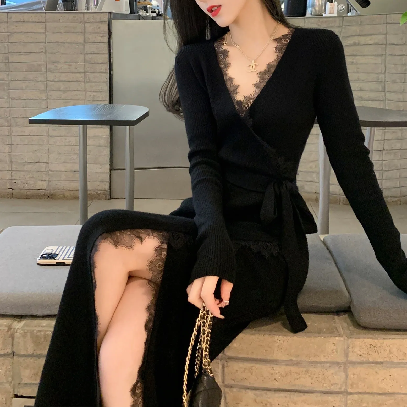 Black women's slim fit woolen skirt dress with a midi length and princess cut.