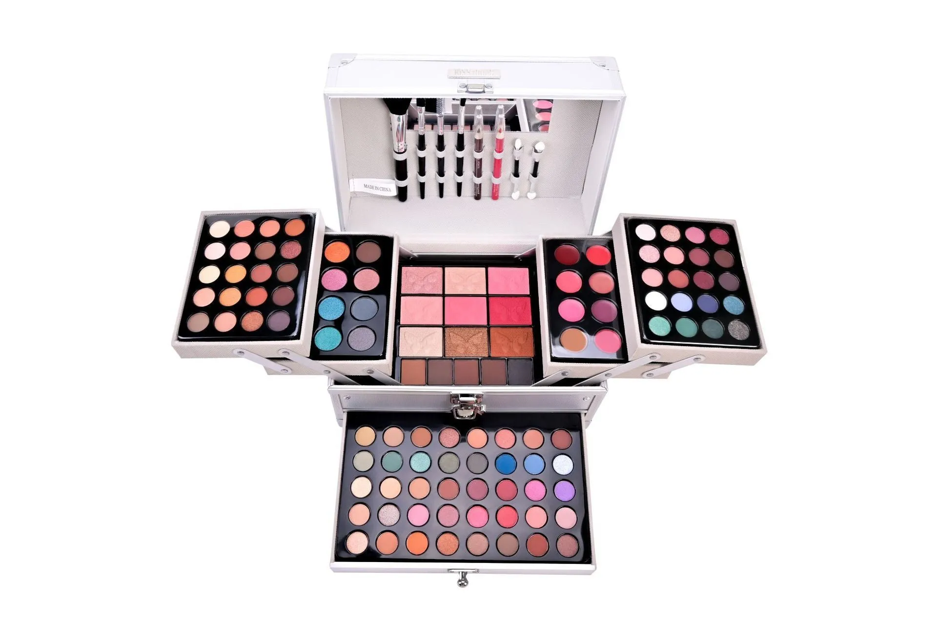 Silver makeup set with eye shadow, blush, lip gloss, lip pencil, and brush in a compact case