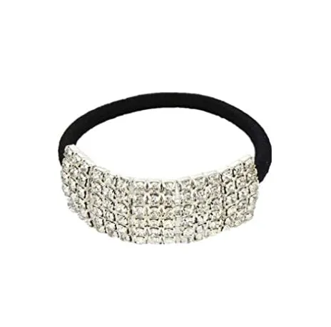 Three silver hair rings with rhinestone crystals on a light background