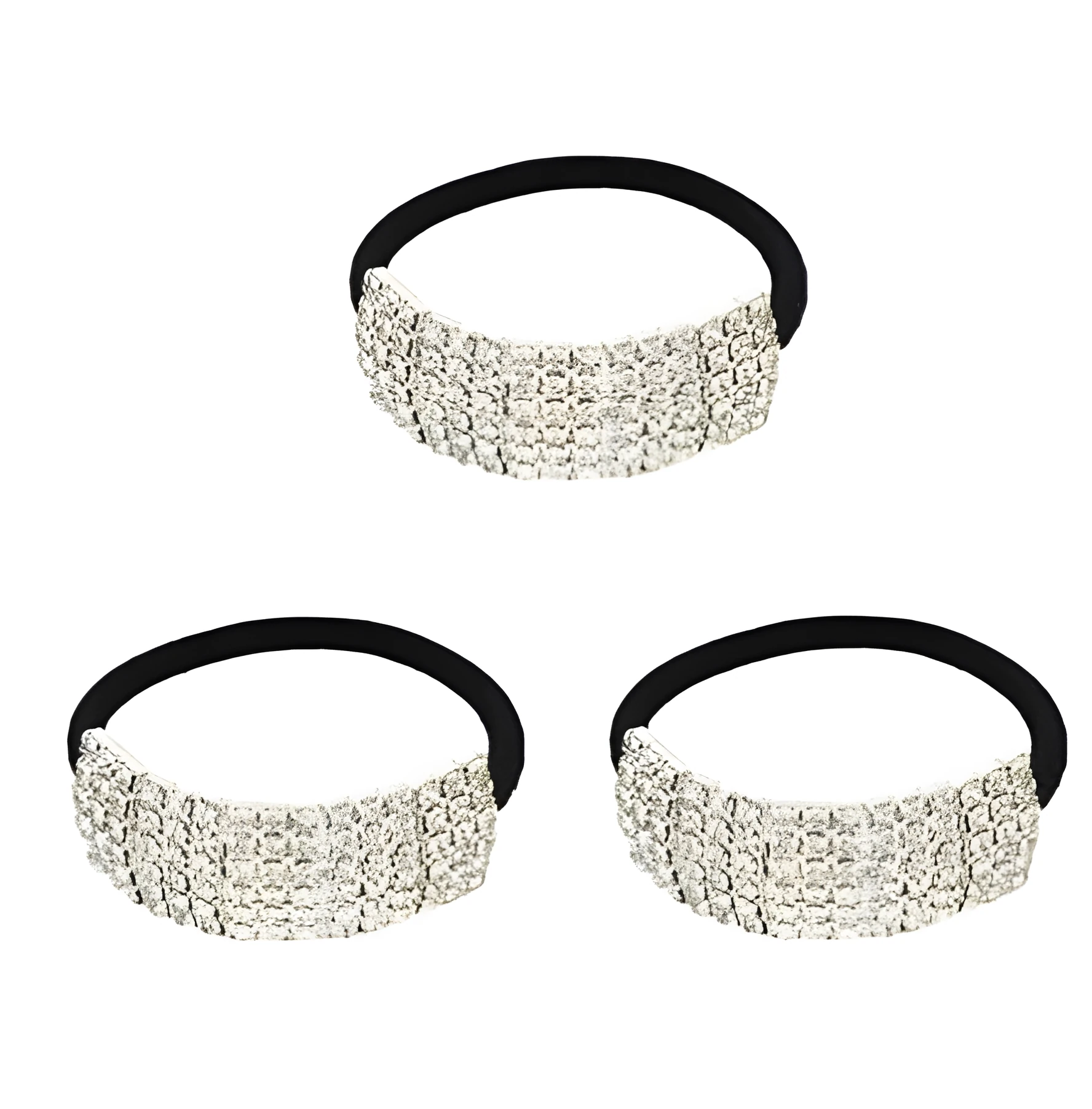 Three silver hair rings with rhinestone crystals on a light background