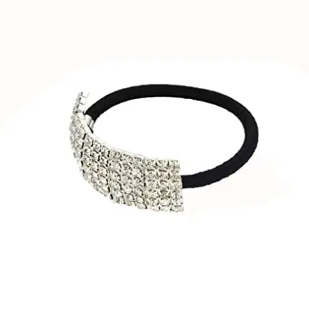 Three silver hair rings with rhinestone crystals on a light background