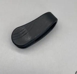 Tiger mouth massage clip multi-function acupoint massager in black on a hand, showing placement between thumb and index finger