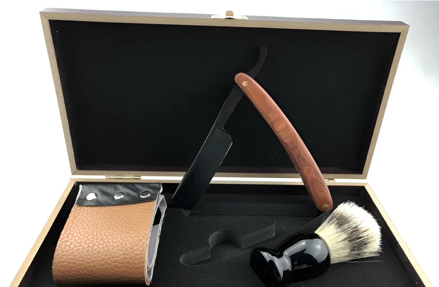 Shaving kit gift set with double edge safety razor, shaving brush, stand, soap cup, and travel pouch on a wooden surface.