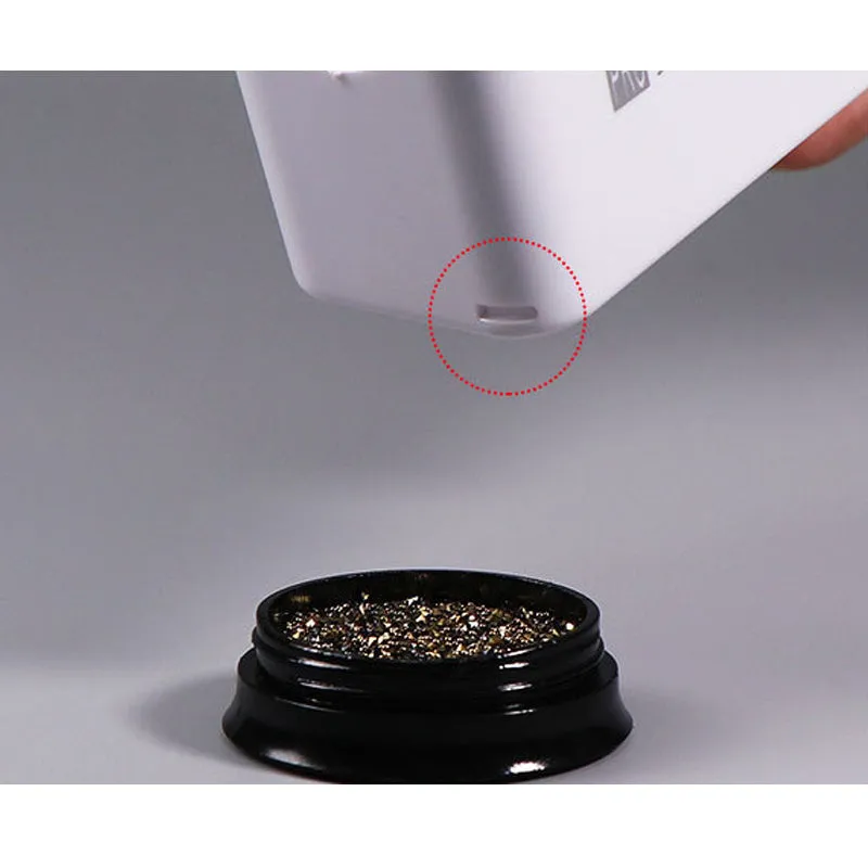 Three-layer white plastic nail powder box on a table for storing nail powder containers