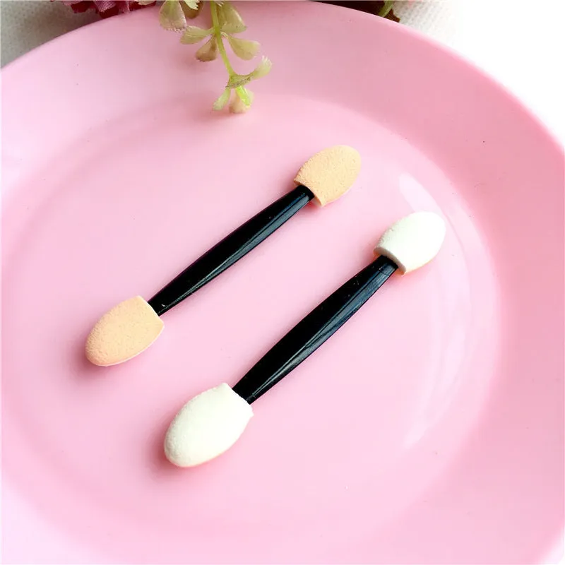 Double-ended sponge makeup brush with plastic handle in black colour for eye shadow application