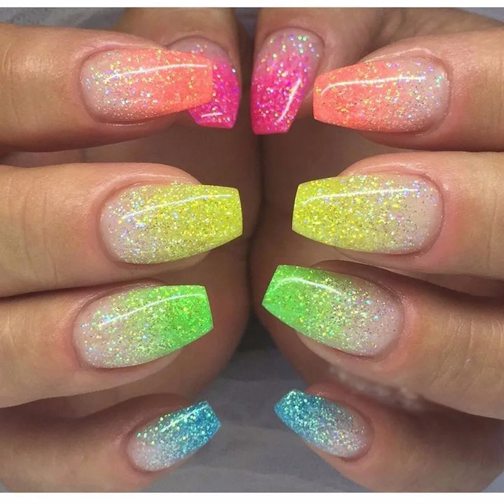 Six 1g pots of neon nail glitter powder in blue, green, orange, pink, purple, and yellow colours on a white background