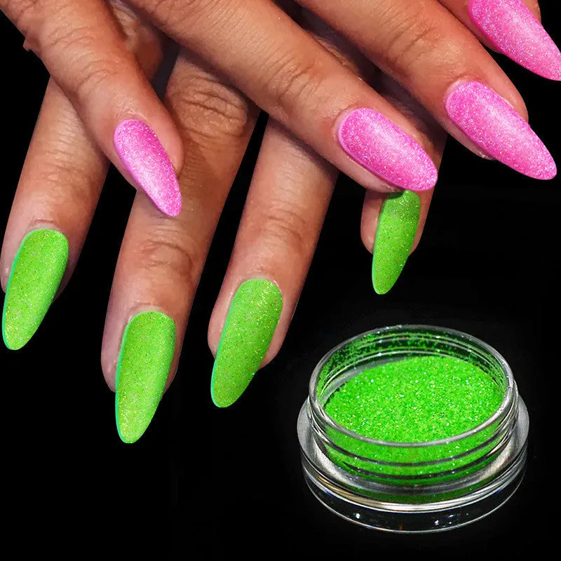 Six 1g pots of neon nail glitter powder in blue, green, orange, pink, purple, and yellow colours on a white background