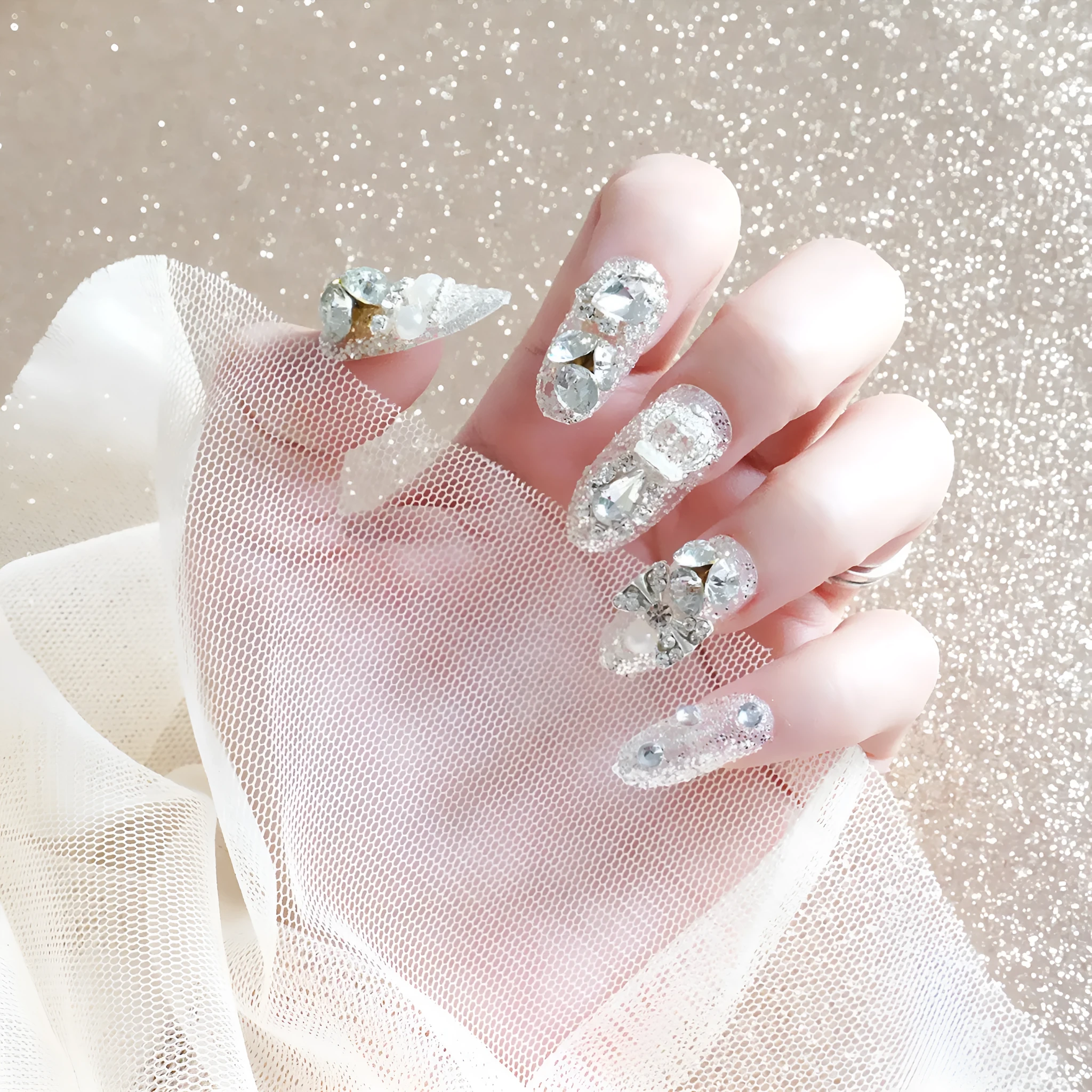 Finished fake nails set of 24 with silver water drops pattern in wearing armour style
