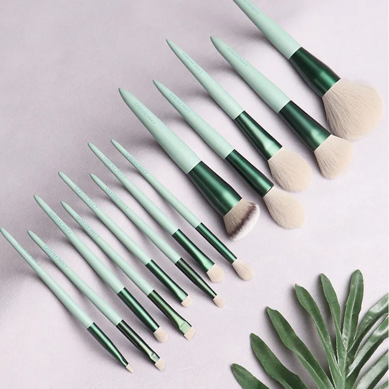 Green 13-piece makeup brush set with fibre wool bristles metal aluminium ferrules and natural wood handles