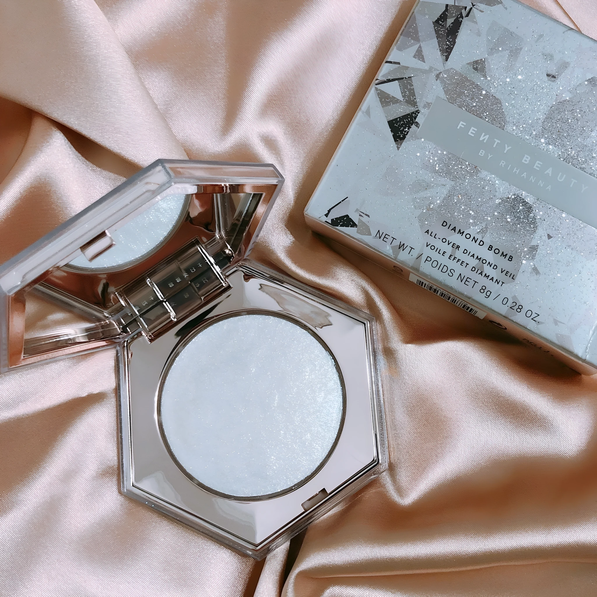 Fenty Beauty Diamond Bomb high gloss powder in compact with diamond-cut packaging