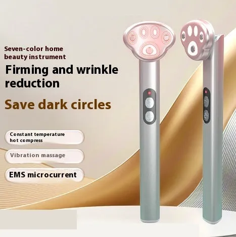 Gradient pink Cat's Paw shape micro-current eye massager with colour light therapy on a white background.