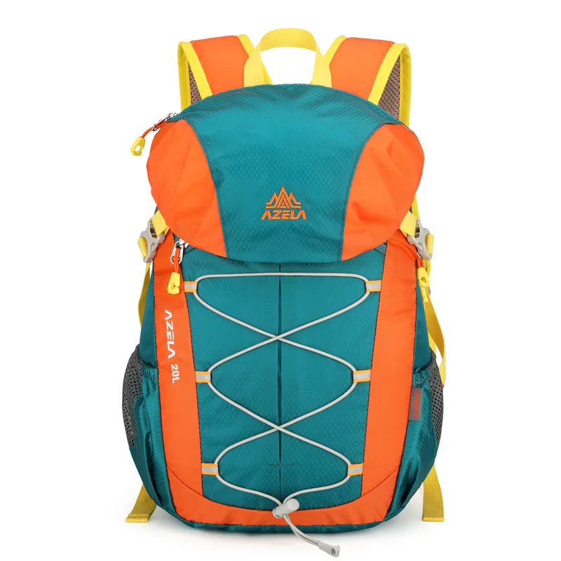 AZELA 20L Color Block Lightweight Hiking Backpack in orange and black, front view, on a rocky outdoor surface