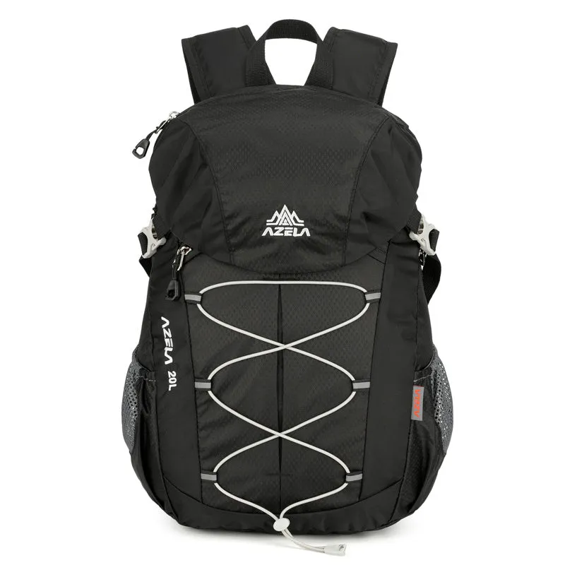 AZELA 20L Color Block Lightweight Hiking Backpack in orange and black, front view, on a rocky outdoor surface