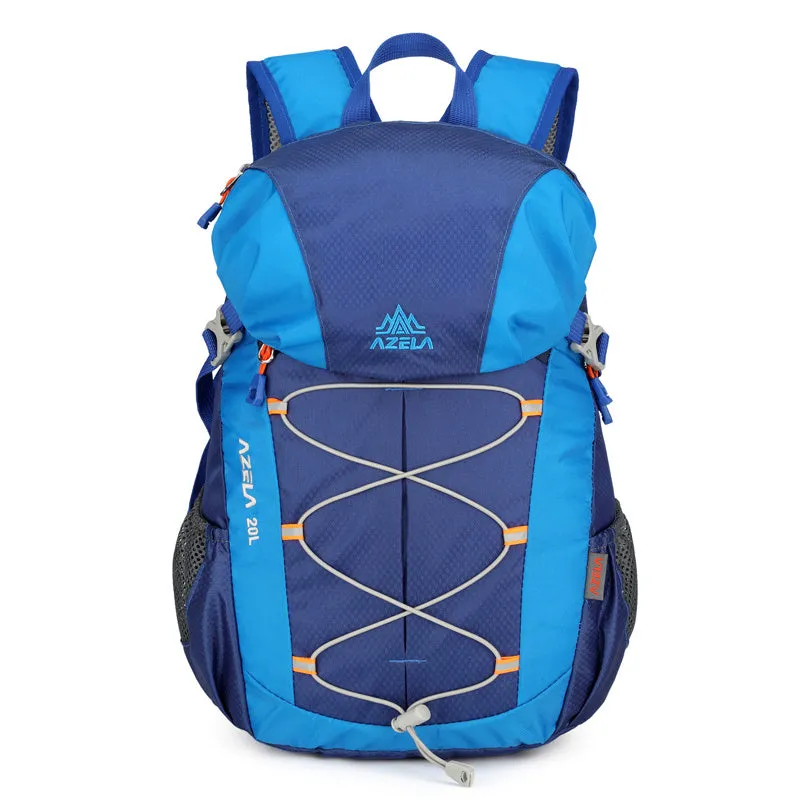 AZELA 20L Color Block Lightweight Hiking Backpack in orange and black, front view, on a rocky outdoor surface