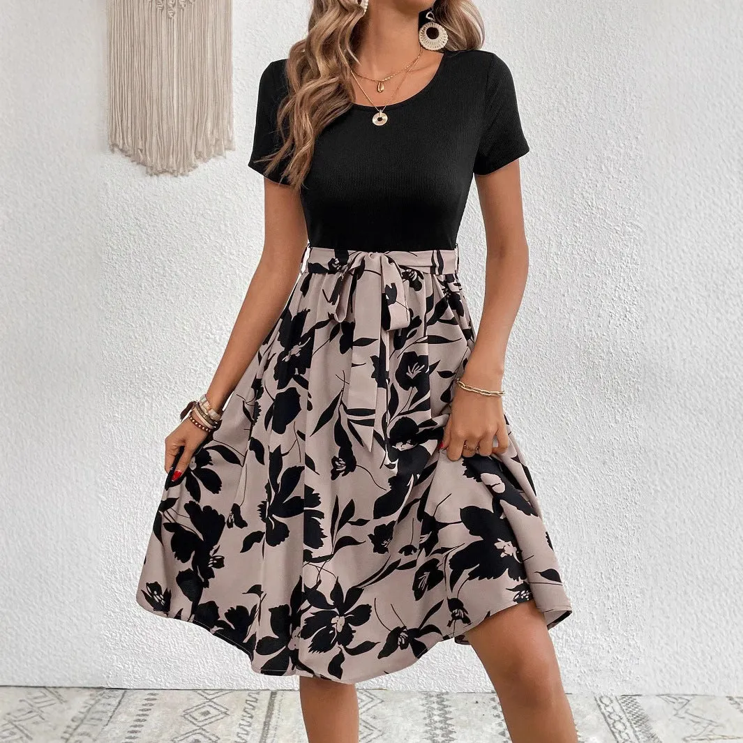 Khaki women's A-line dress with a floral print pattern and a lace-up shoulder strap detail.