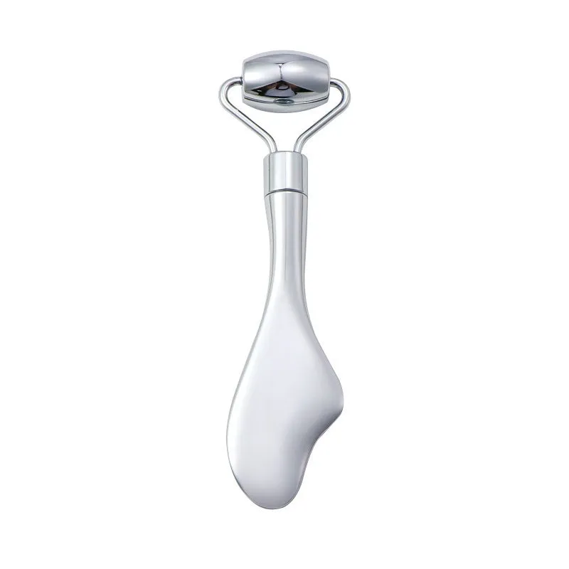 Stainless steel double-headed facial roller, heart-shaped acupressure stick, and scraping plate on a white background.