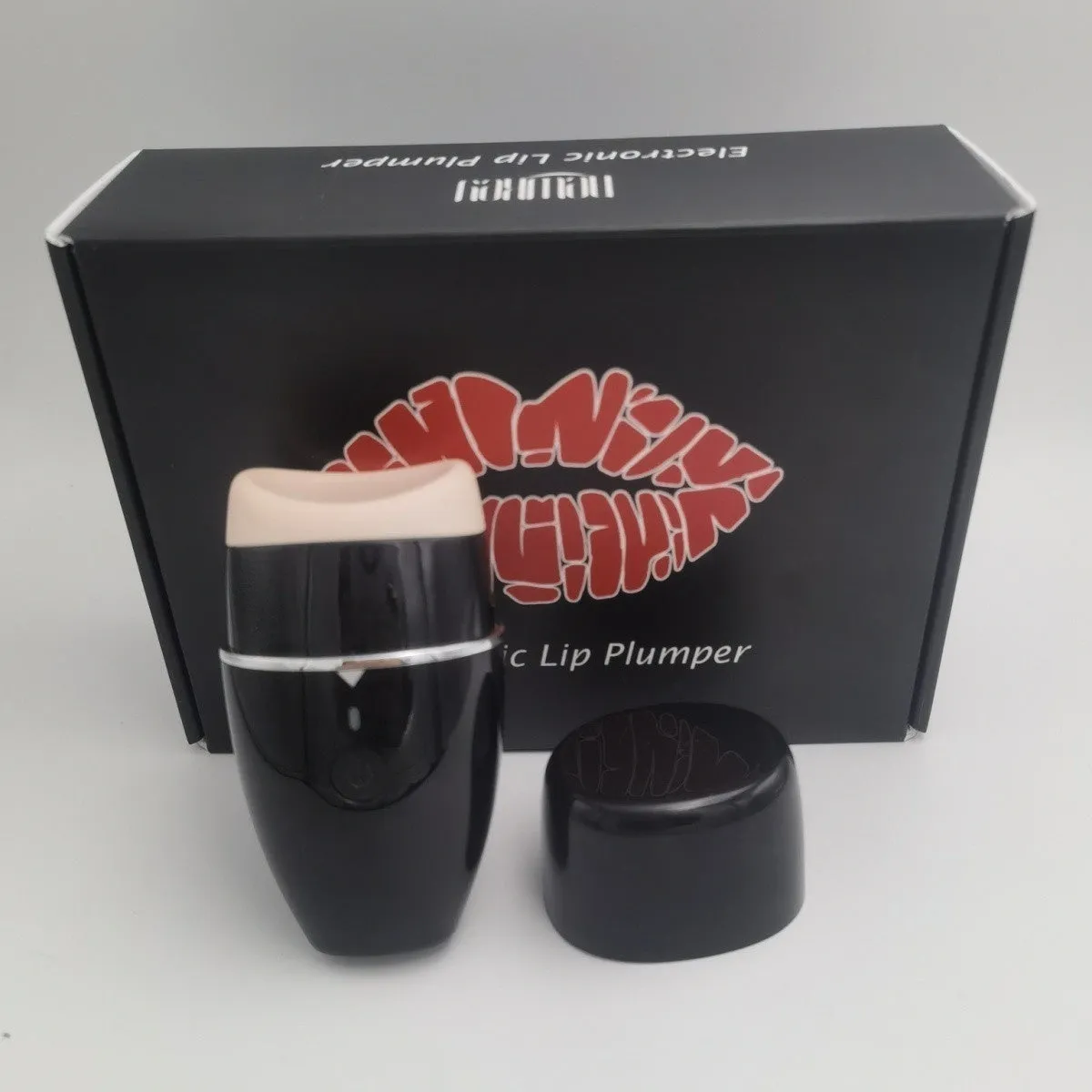 Electric lip plumper device with USB cable in black or white colour options