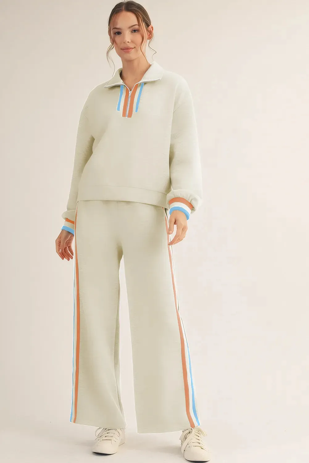 Apricot striped patchwork quarter zip pullover and loose pant set on model, women's two-piece loungewear