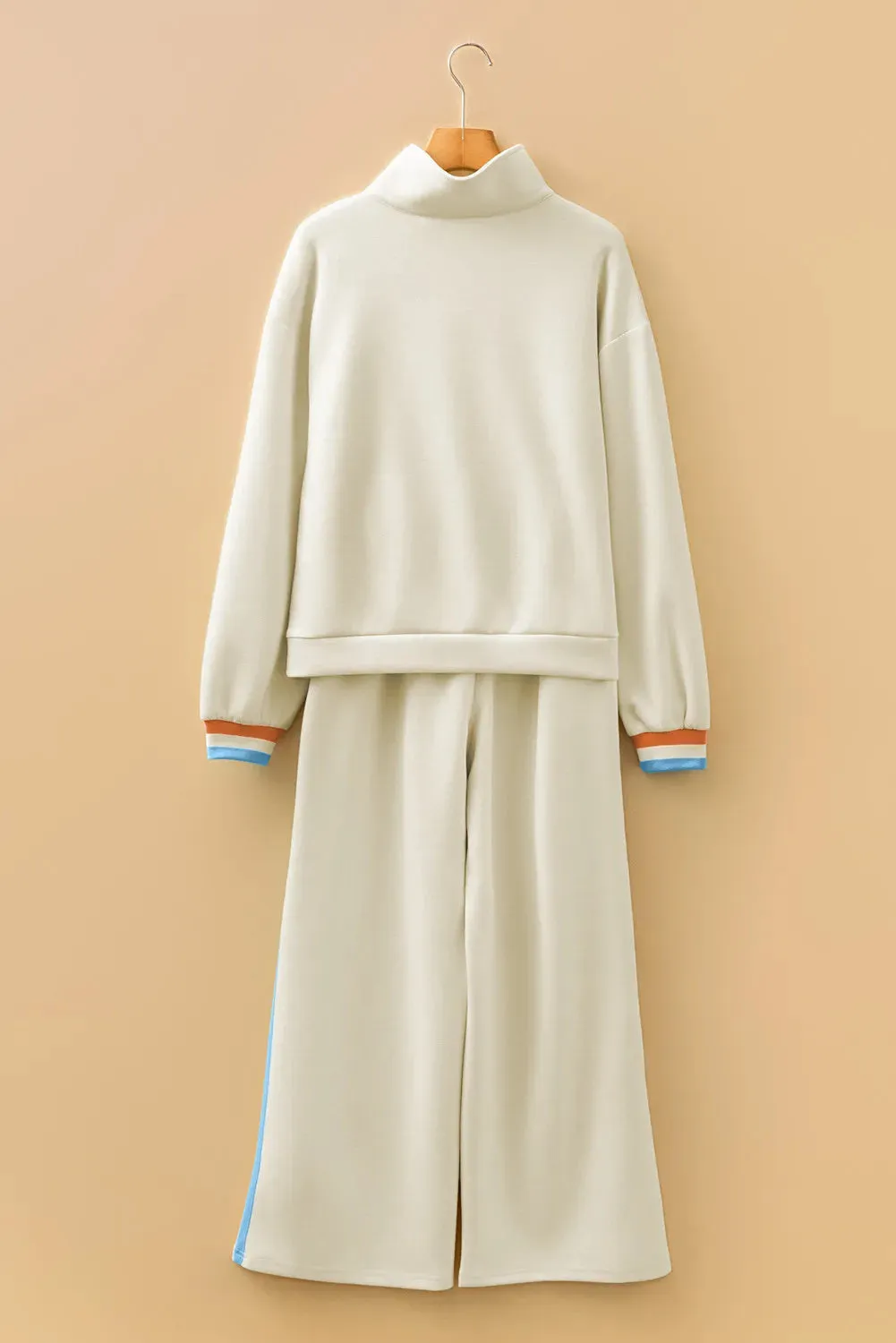 Apricot striped patchwork quarter zip pullover and loose pant set on model, women's two-piece loungewear