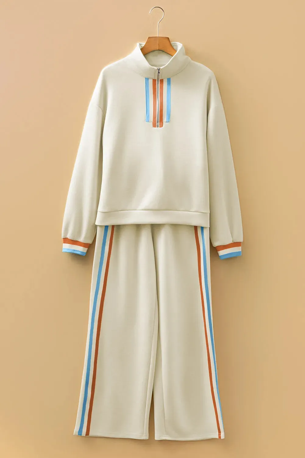 Apricot striped patchwork quarter zip pullover and loose pant set on model, women's two-piece loungewear