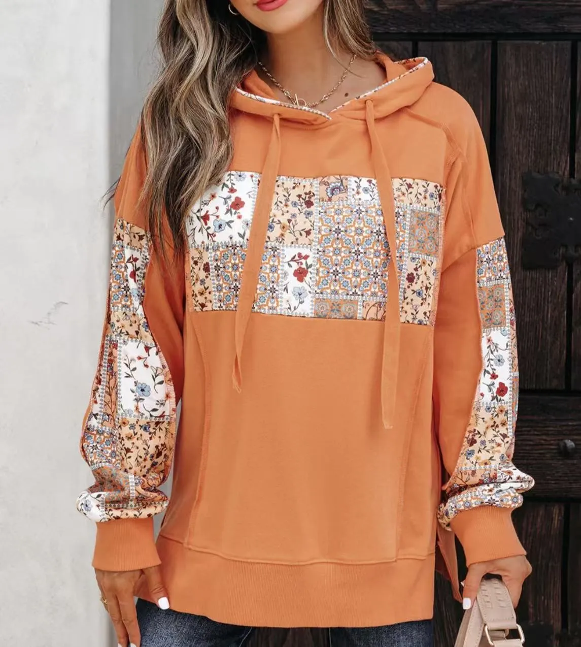 Women's pullover hoodie with drawstrings, loose fit, long sleeves, in pink colour, front view