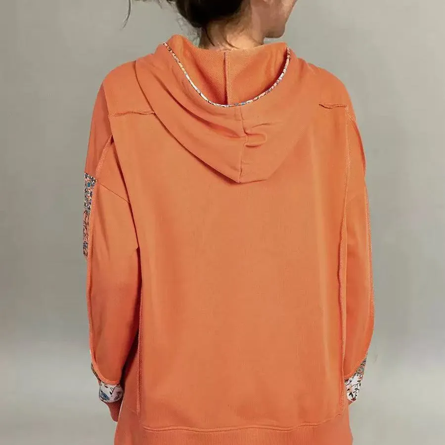 Women's pullover hoodie with drawstrings, loose fit, long sleeves, in pink colour, front view