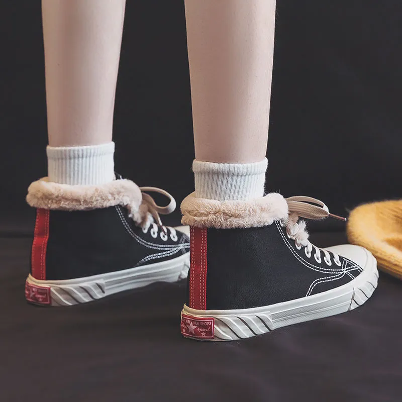 Black women's winter canvas shoes with velvet lining, animal pattern, buckle fastening, low-top rubber sole.