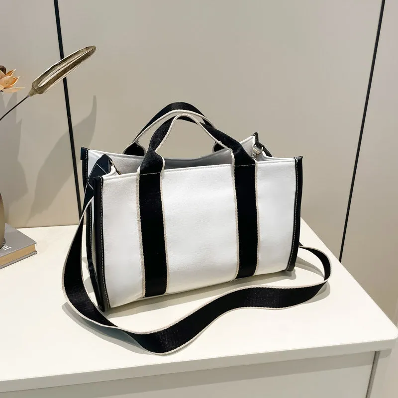 Large-capacity canvas tote bag in black with open pocket, horizontal square shape, single shoulder strap