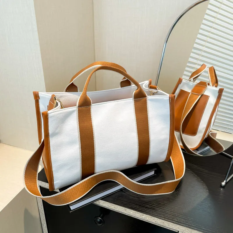 Large-capacity canvas tote bag in black with open pocket, horizontal square shape, single shoulder strap