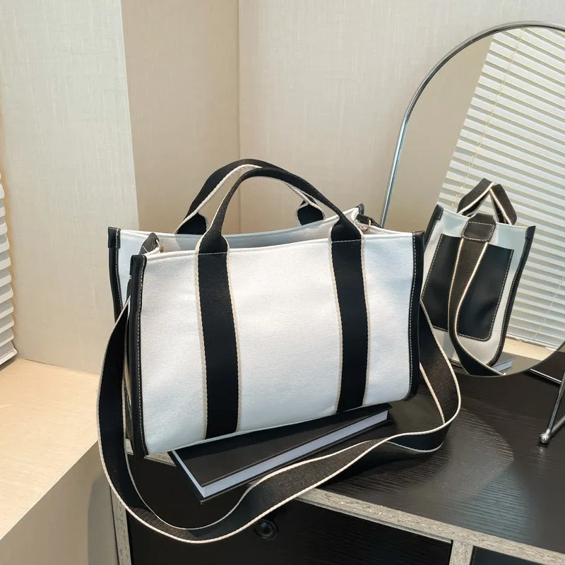 Large-capacity canvas tote bag in black with open pocket, horizontal square shape, single shoulder strap